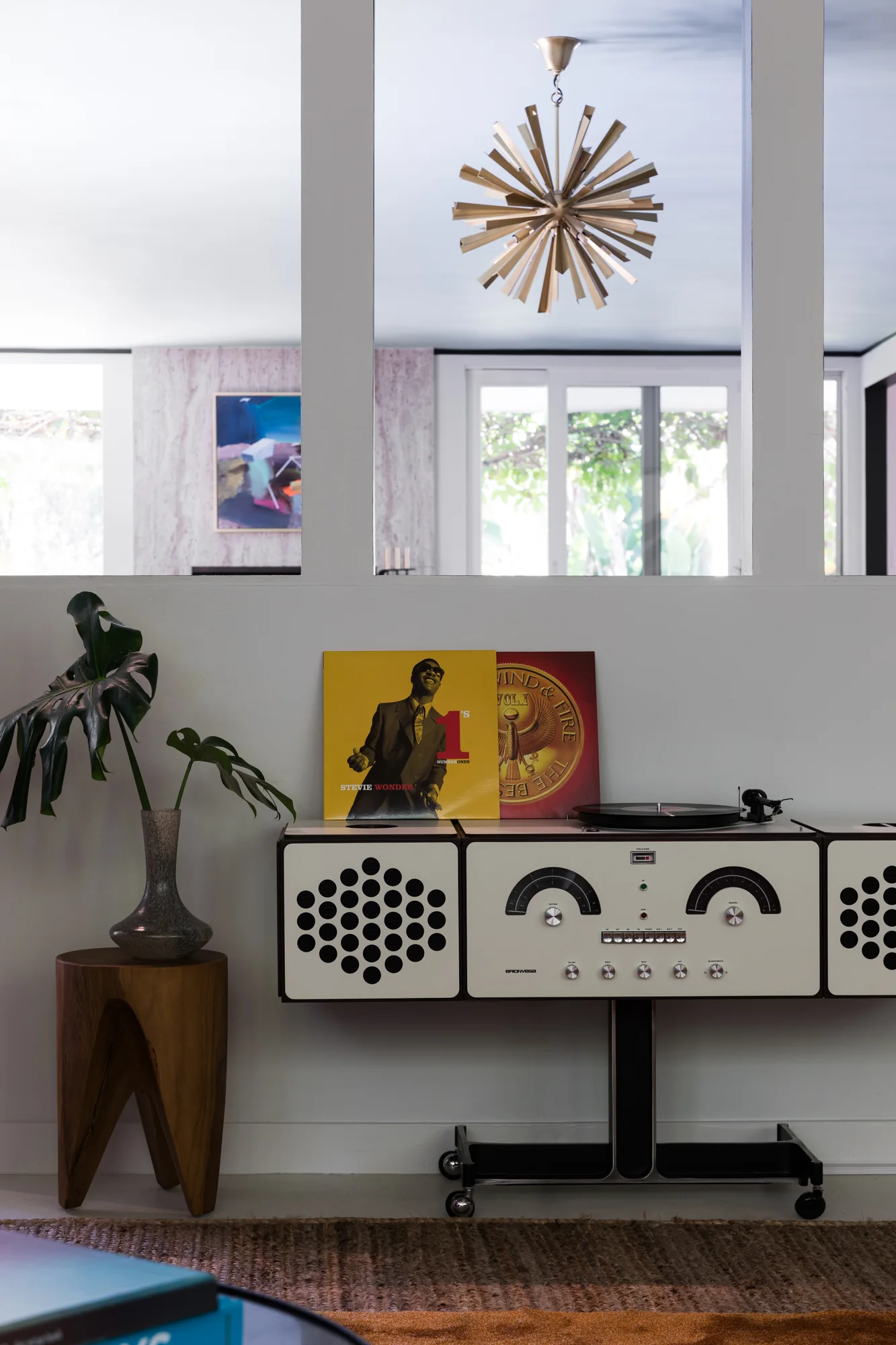 Vintage record console beneath a framed print