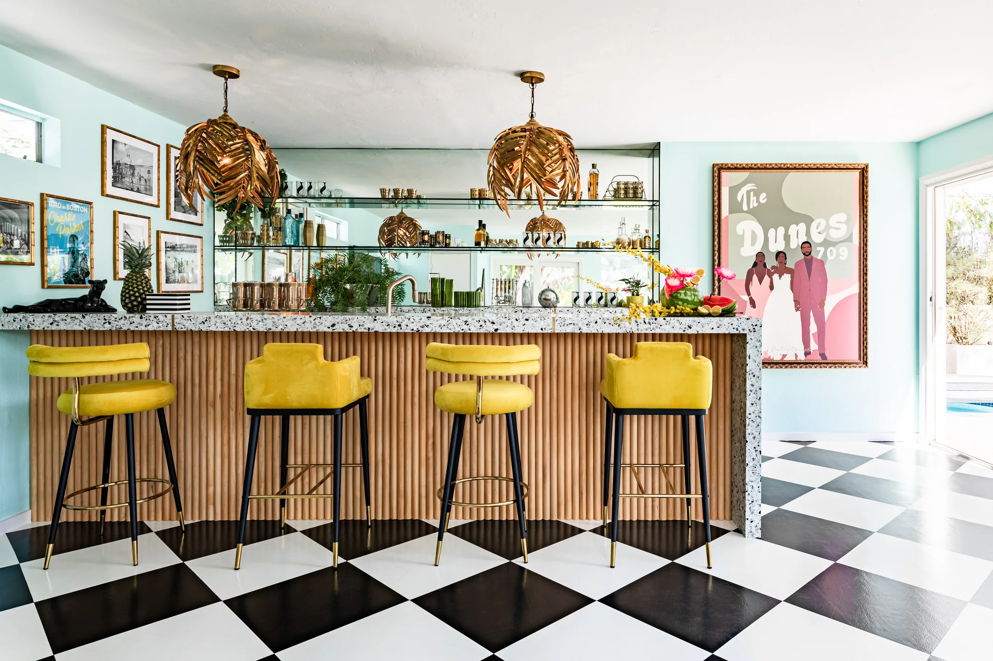 The full pool-house bar on a checkerboard floor