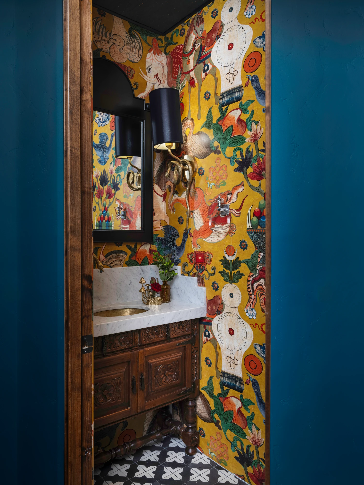 Looking through the doorway into the yellow-flowered powder room