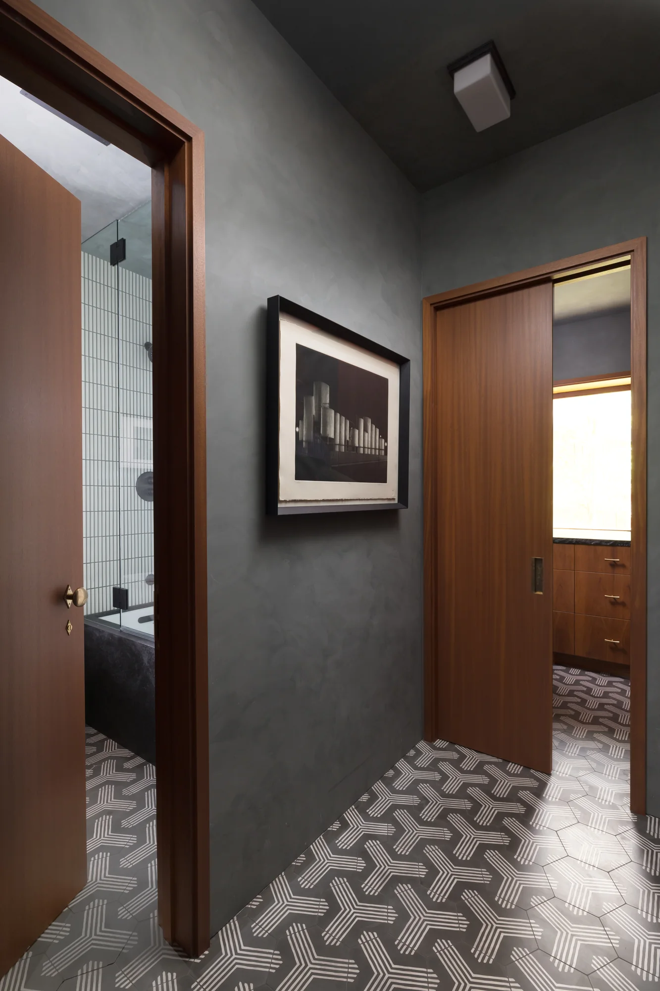 Grey hallway over a patterned tile floor
